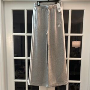 Never worn Adidas gray wide leg sweat pants.  Size small.